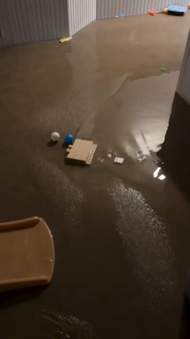 Flooded room with murky water covering the floor